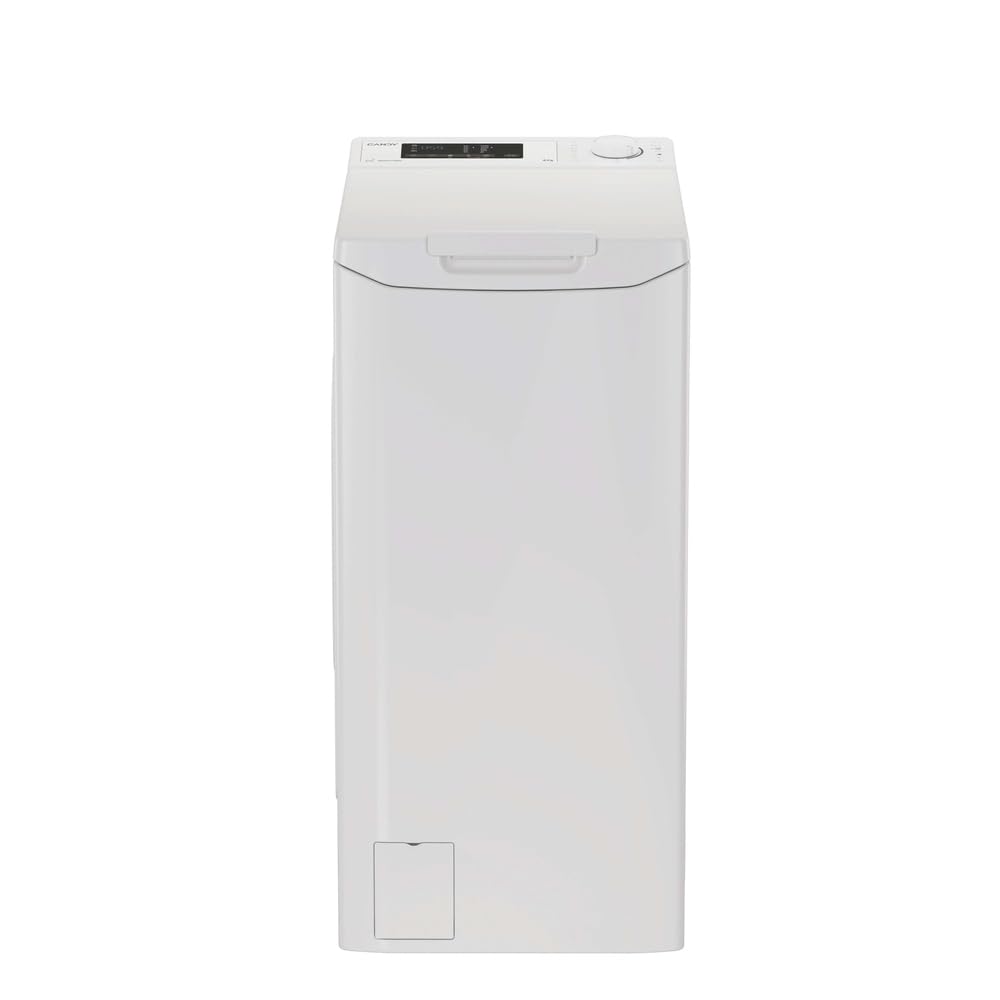 Lave-linge top blanc dans une buanderie lumineuse aux murs blanc cassé et vert sauge