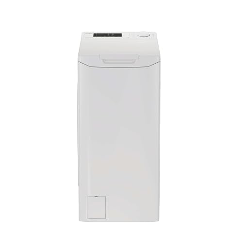 Lave-linge top blanc dans une buanderie lumineuse aux murs blanc cassé et vert sauge