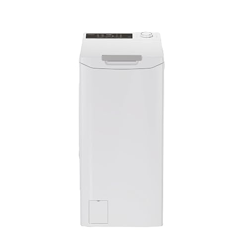 Lave-linge top blanc Candy de 8 kg présenté dans une buanderie lumineuse et sobre.